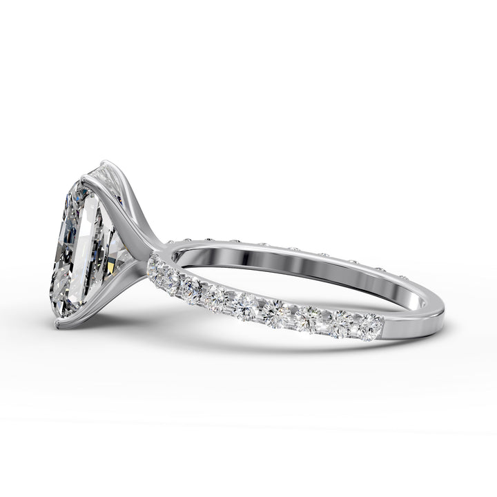 Radiant diamond pavé engagement ring with elongated center stone displayed from multiple angles.