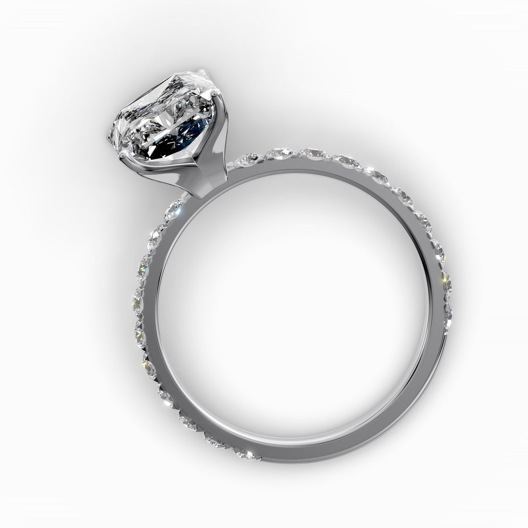 Radiant diamond pavé engagement ring with elongated center stone displayed from multiple angles.
