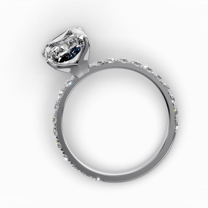 Radiant diamond pavé engagement ring with elongated center stone displayed from multiple angles.