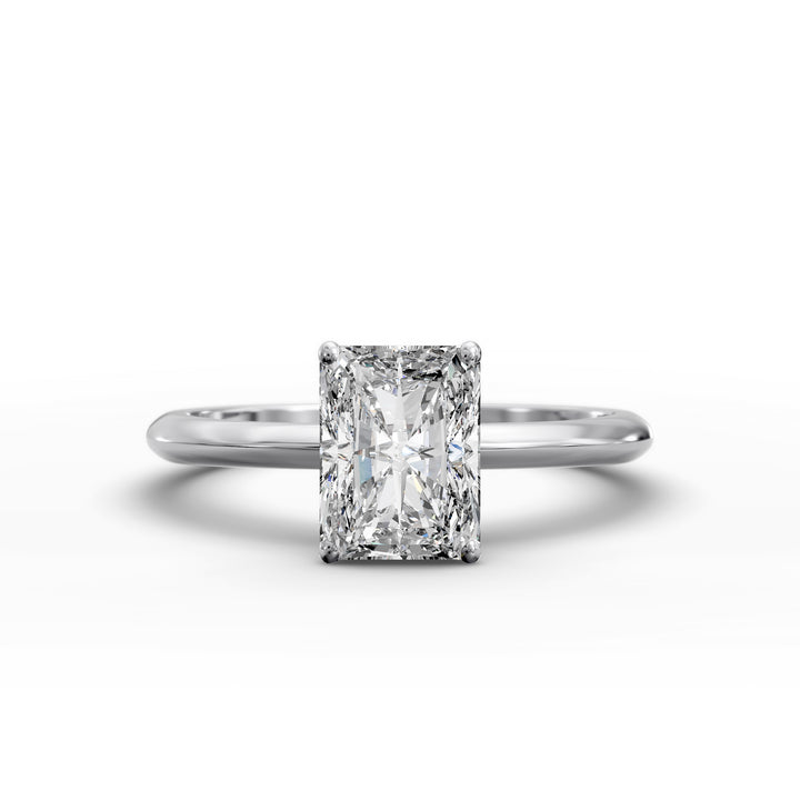 Radiant cut diamond solitaire engagement ring with a classic smooth band shown in display view.