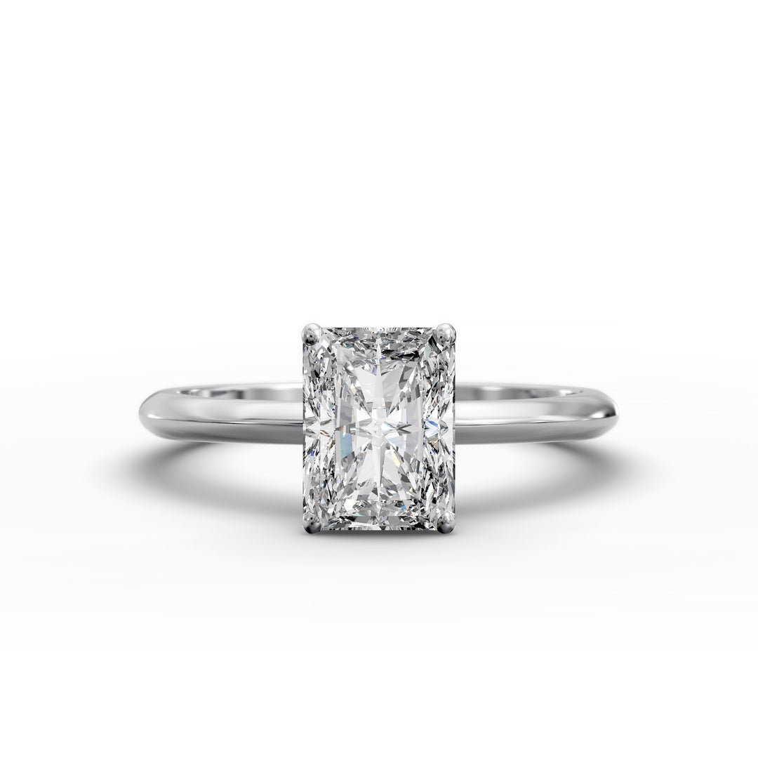 Radiant cut diamond solitaire engagement ring with a classic smooth band shown in display view.