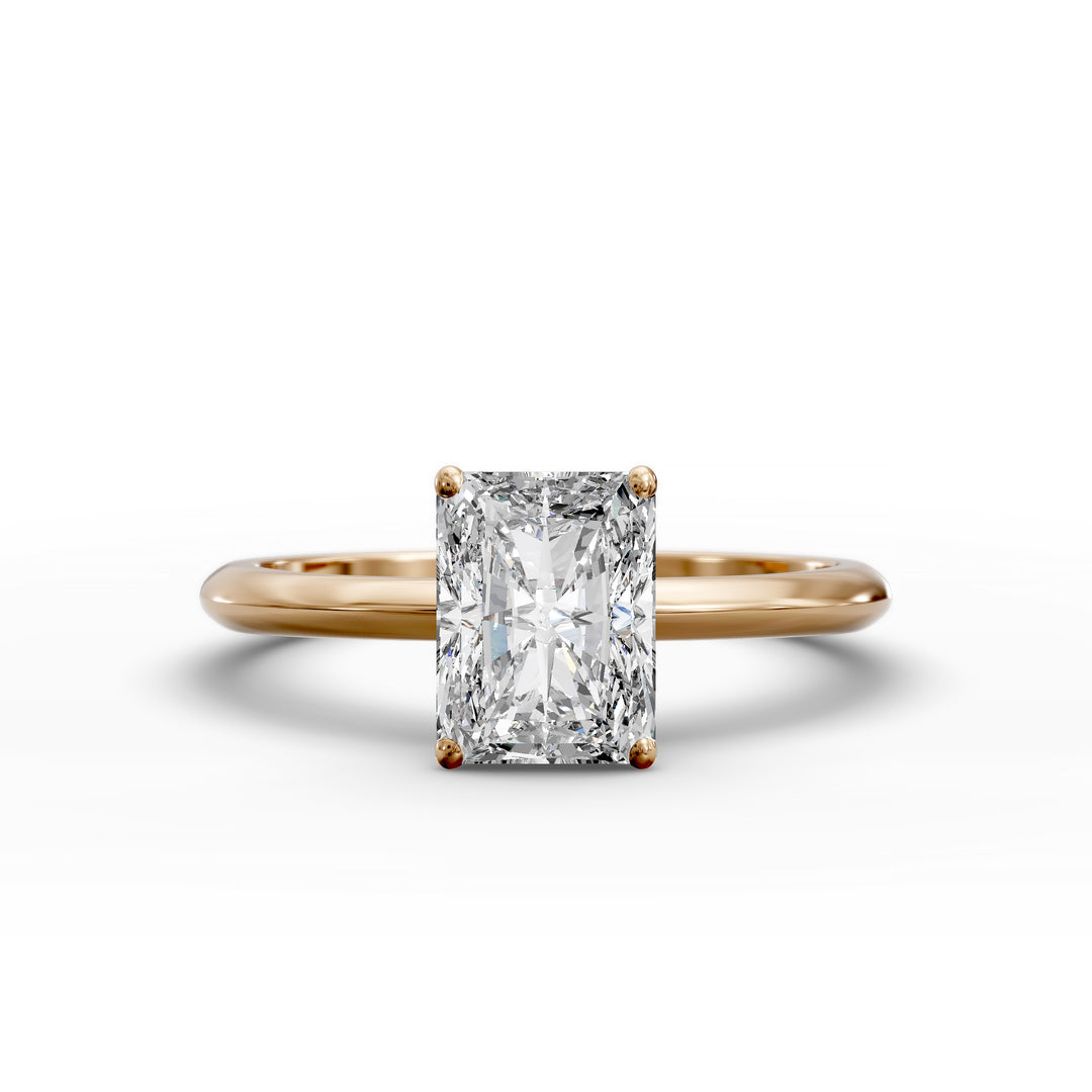 Radiant cut diamond solitaire engagement ring with a classic smooth band shown in display view.