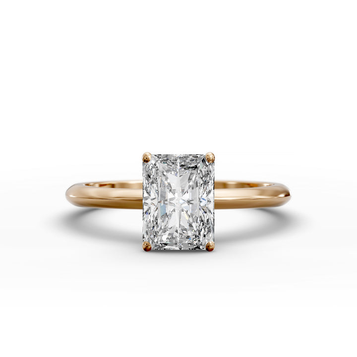 Radiant cut diamond solitaire engagement ring with a classic smooth band shown in display view.