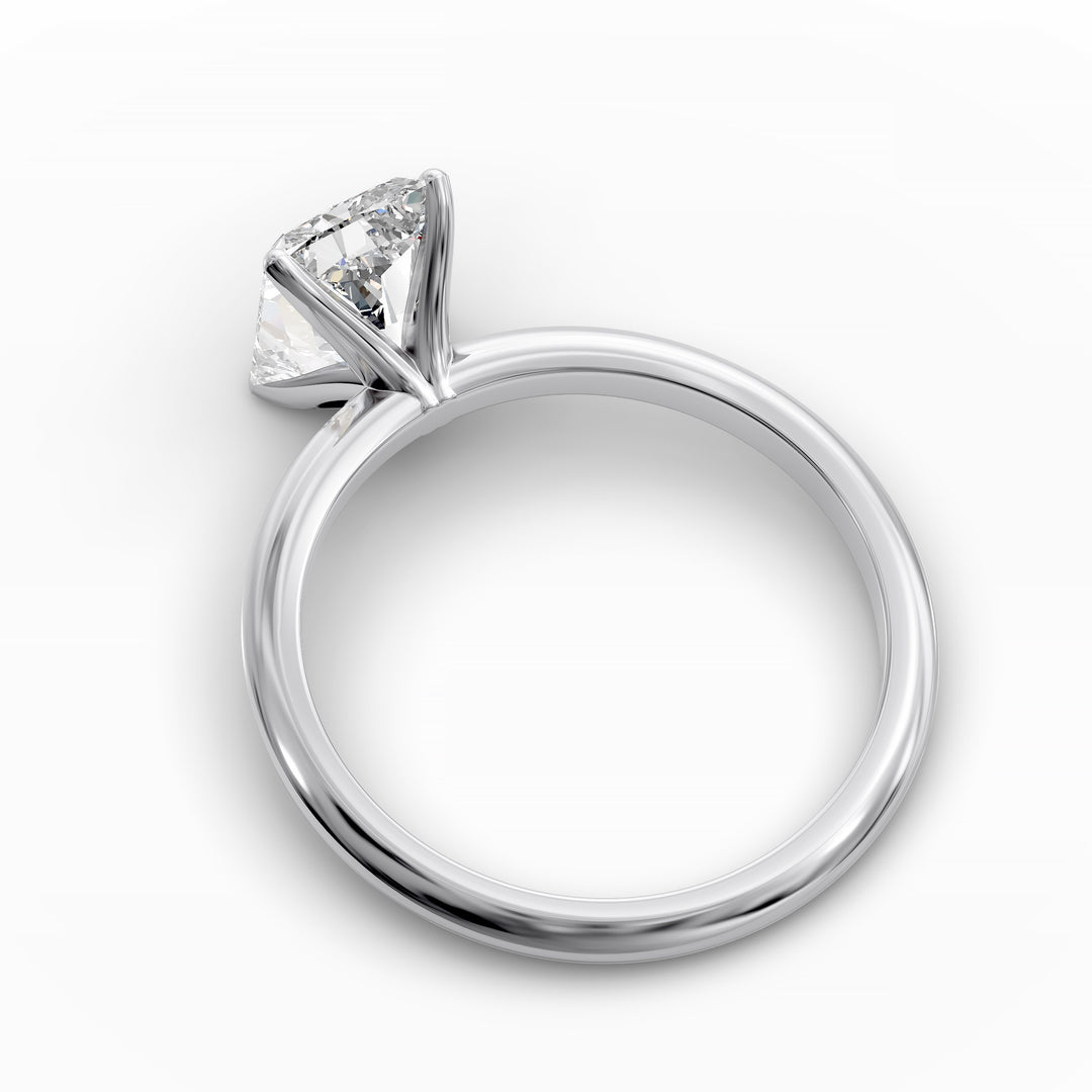 Radiant cut diamond solitaire engagement ring with a classic smooth band shown in display view.