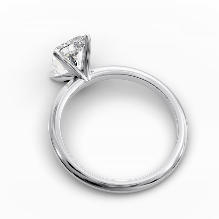 Radiant cut diamond solitaire engagement ring with a classic smooth band shown in display view.