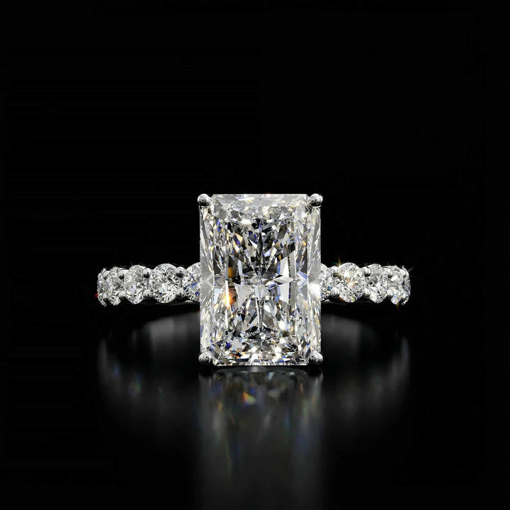 Radiant diamond hidden halo engagement ring with diamonds on band shown in display view.