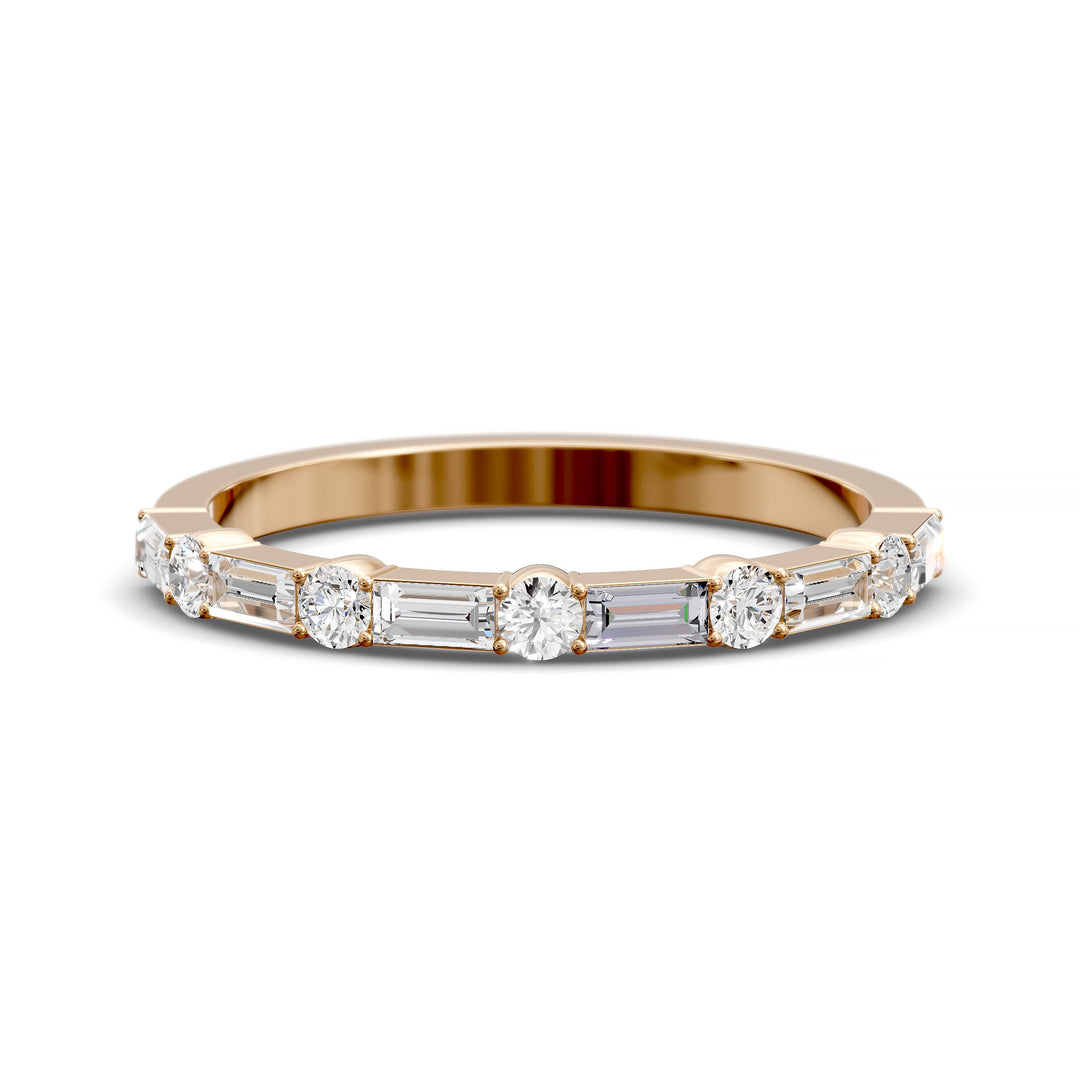 Modern gold wedding band with alternating round and baguette-cut diamonds