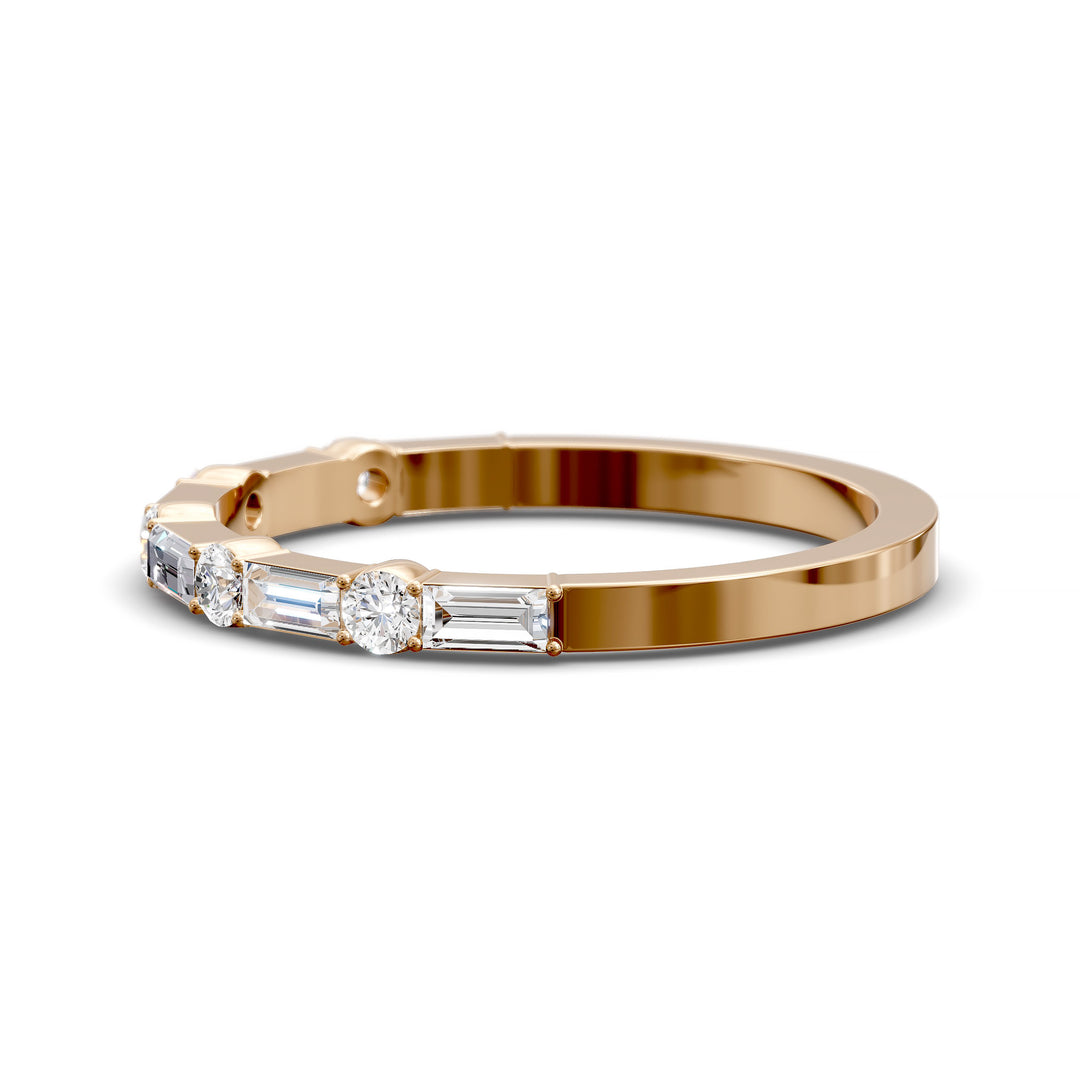 Modern gold wedding band with alternating round and baguette-cut diamonds