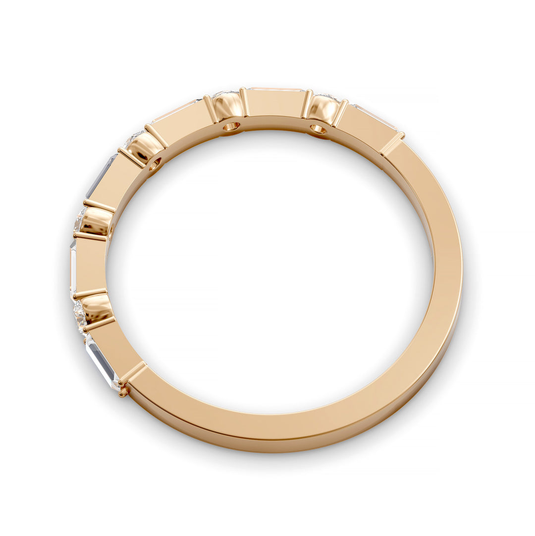 Modern gold wedding band with alternating round and baguette-cut diamonds