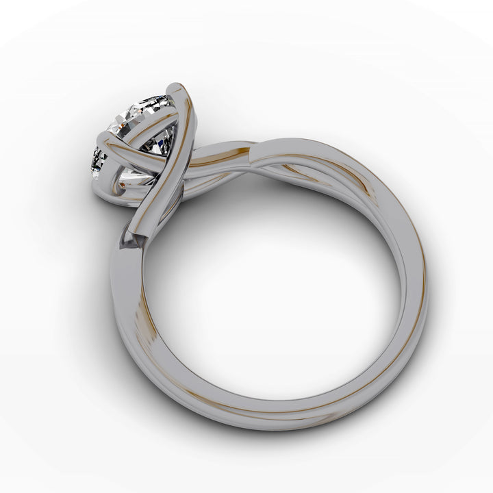 Round diamond engagement ring with infinity twist band front view.