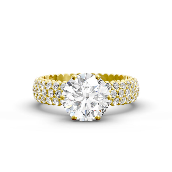 Round diamond engagement ring with six-prong crown setting and multi-row diamond band shown in studio lighting.