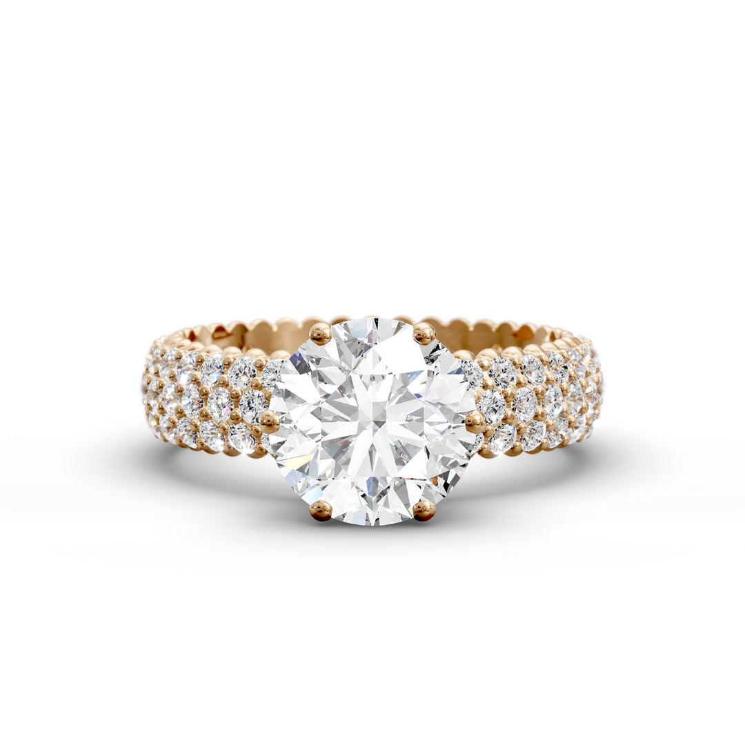 Round diamond engagement ring with six-prong crown setting and multi-row diamond band shown in studio lighting.