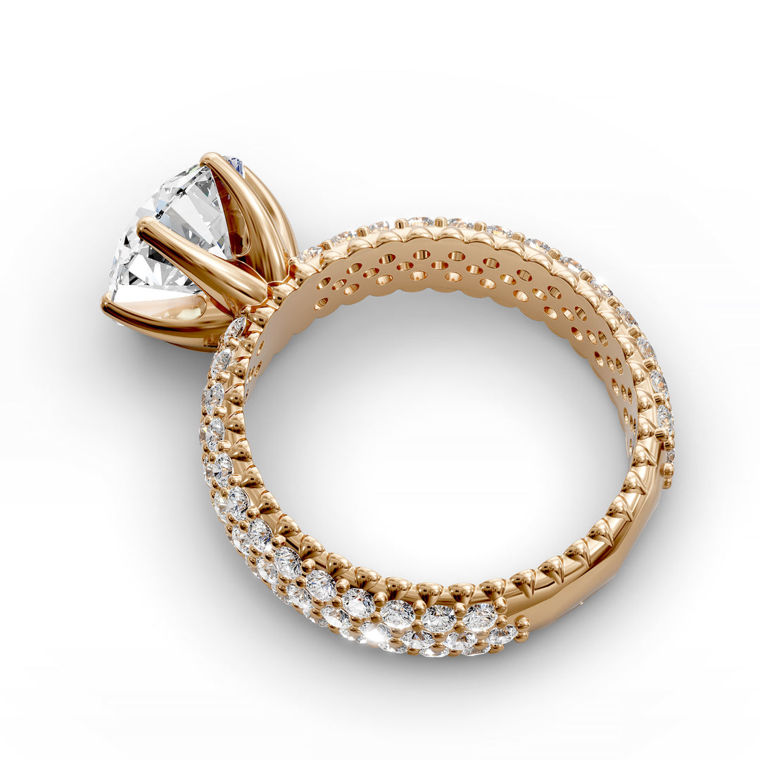 Round diamond engagement ring with six-prong crown setting and multi-row diamond band shown in studio lighting.