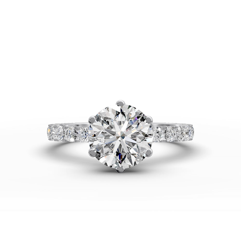 Round diamond pavé engagement ring with six-prong center stone on display.
