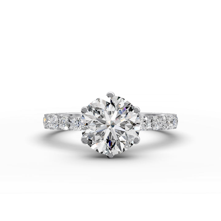 Round diamond pavé engagement ring with six-prong center stone on display.
