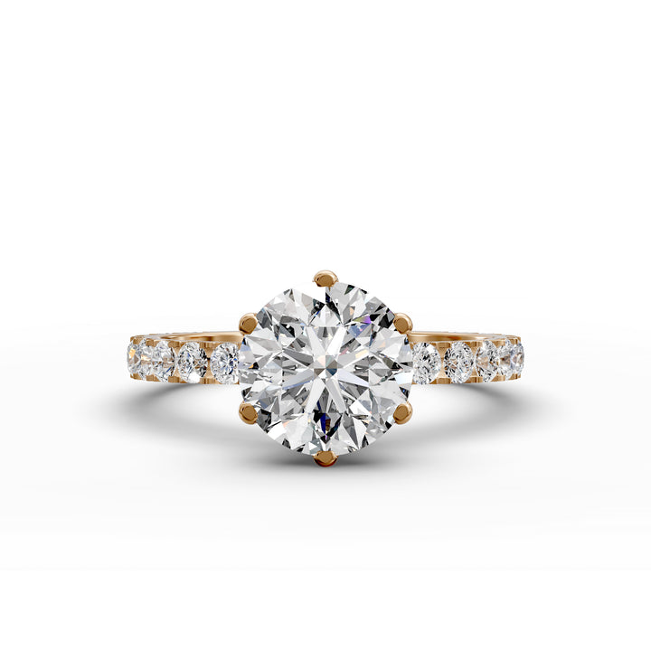 Round diamond pavé engagement ring with six-prong center stone on display.
