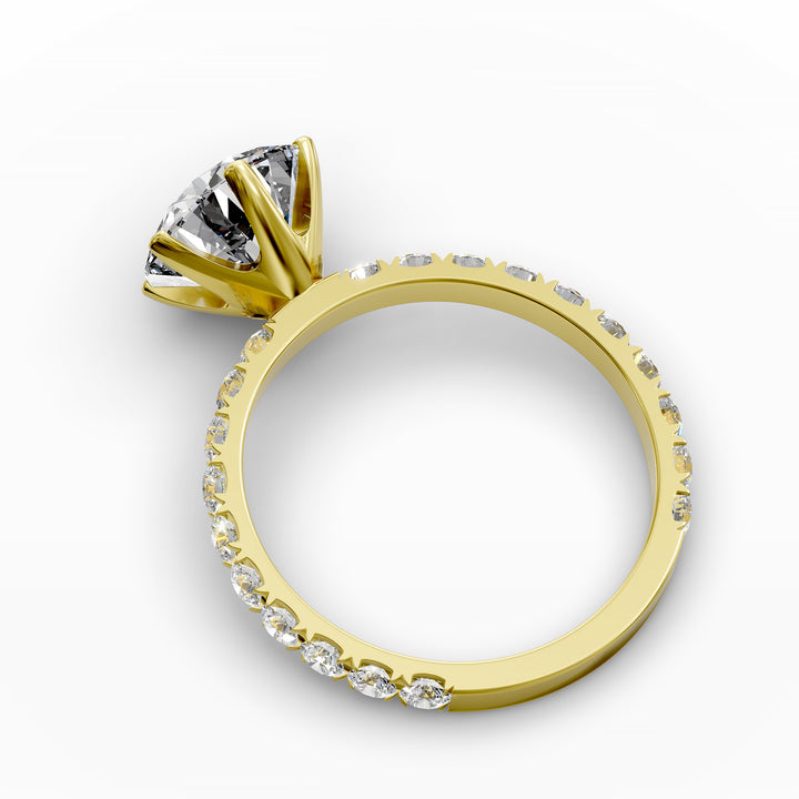 Round diamond pavé engagement ring with six-prong center stone on display.
