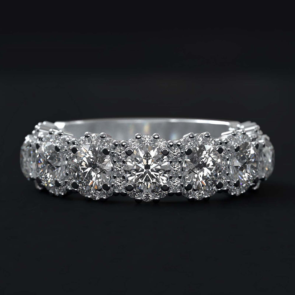 A luxurious diamond band with 9 lab-grown round diamonds surrounded by delicate halos, set in gold or platinum.