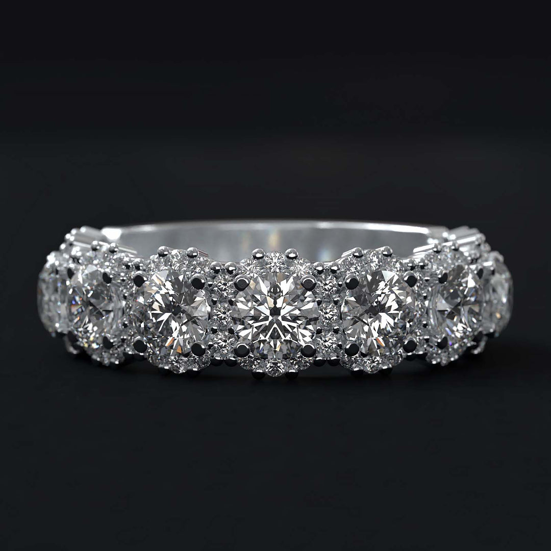 A luxurious diamond band with 9 lab-grown round diamonds surrounded by delicate halos, set in gold or platinum.