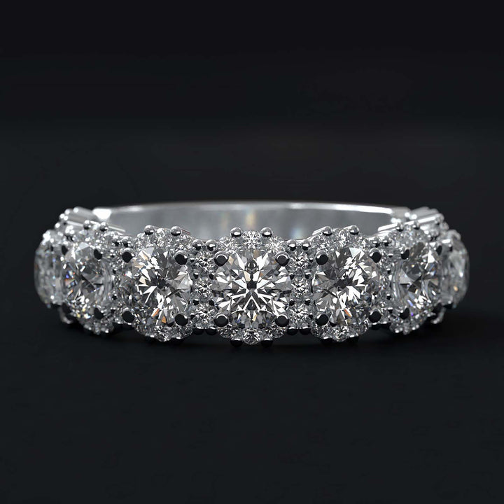 A luxurious diamond band with 9 lab-grown round diamonds surrounded by delicate halos, set in gold or platinum.