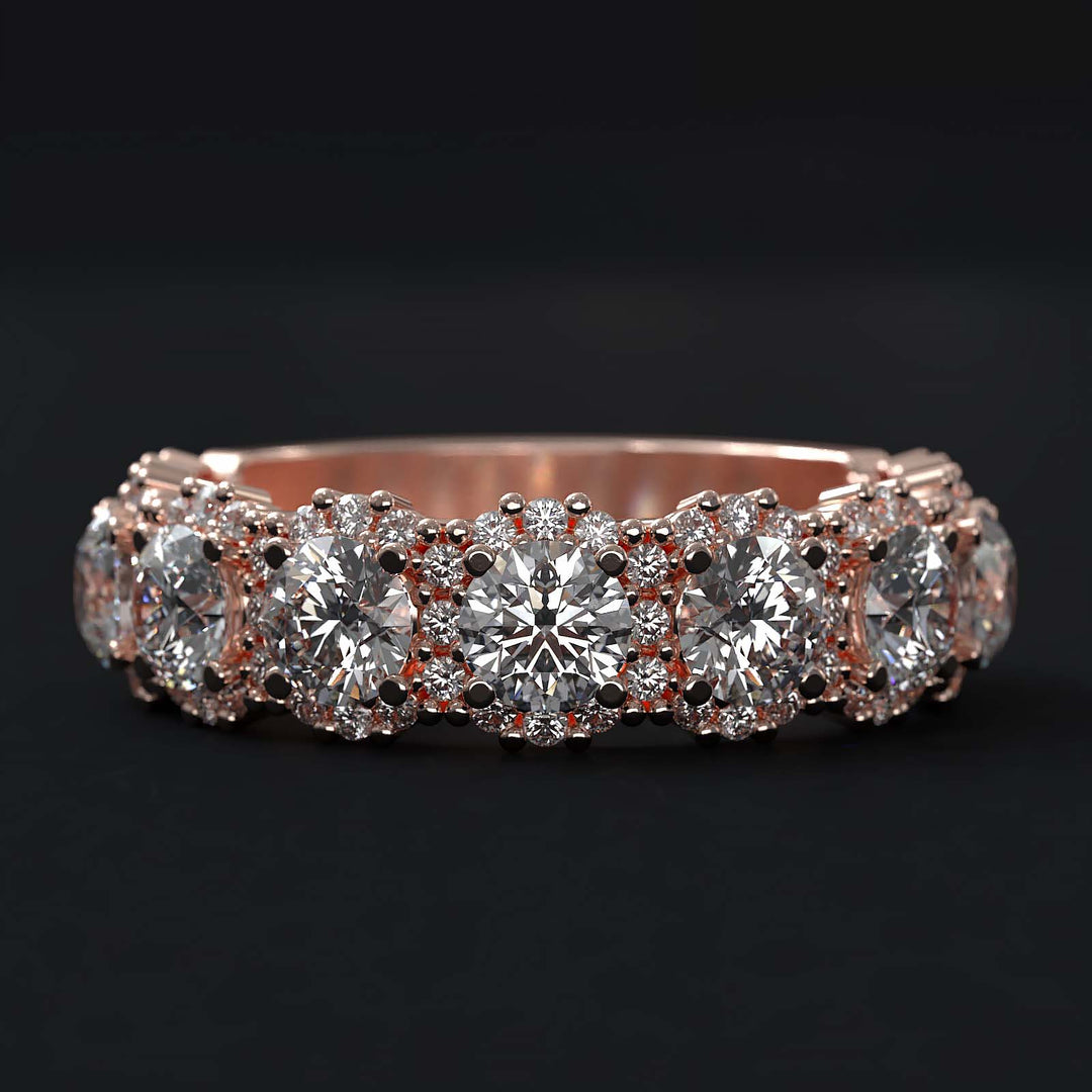 A luxurious diamond band with 9 lab-grown round diamonds surrounded by delicate halos, set in gold or platinum.