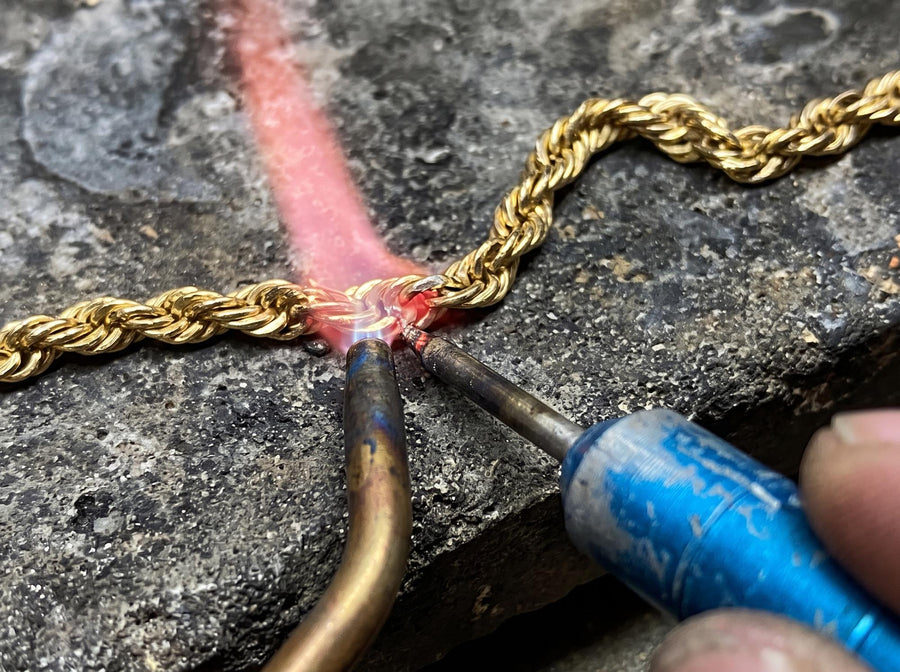 Jewellery repair — soldering a broken gold rope chain at Rudix Jewellery Hamilton