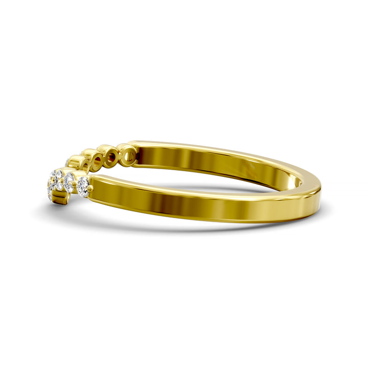 V-shaped gold wedding band with shared prong floating diamonds