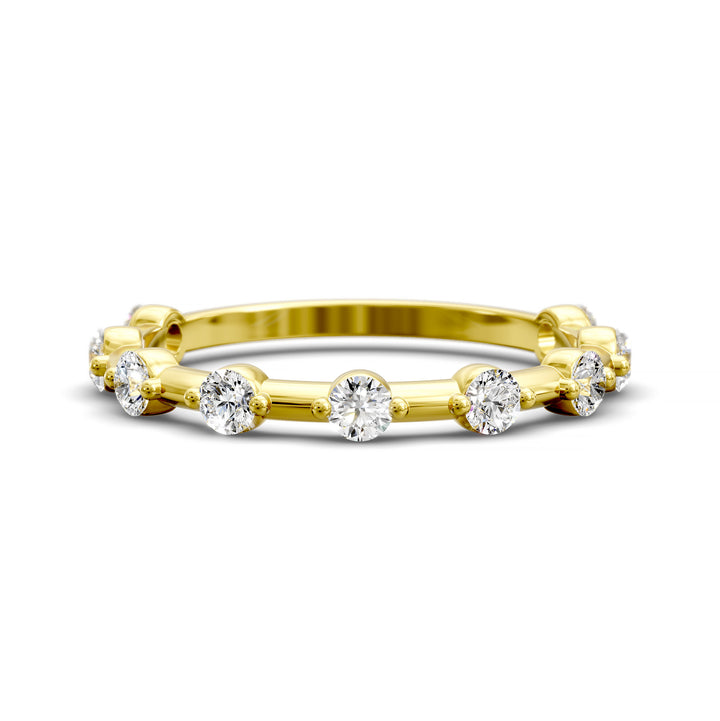 Shared prong eternity wedding band with spaced round diamonds