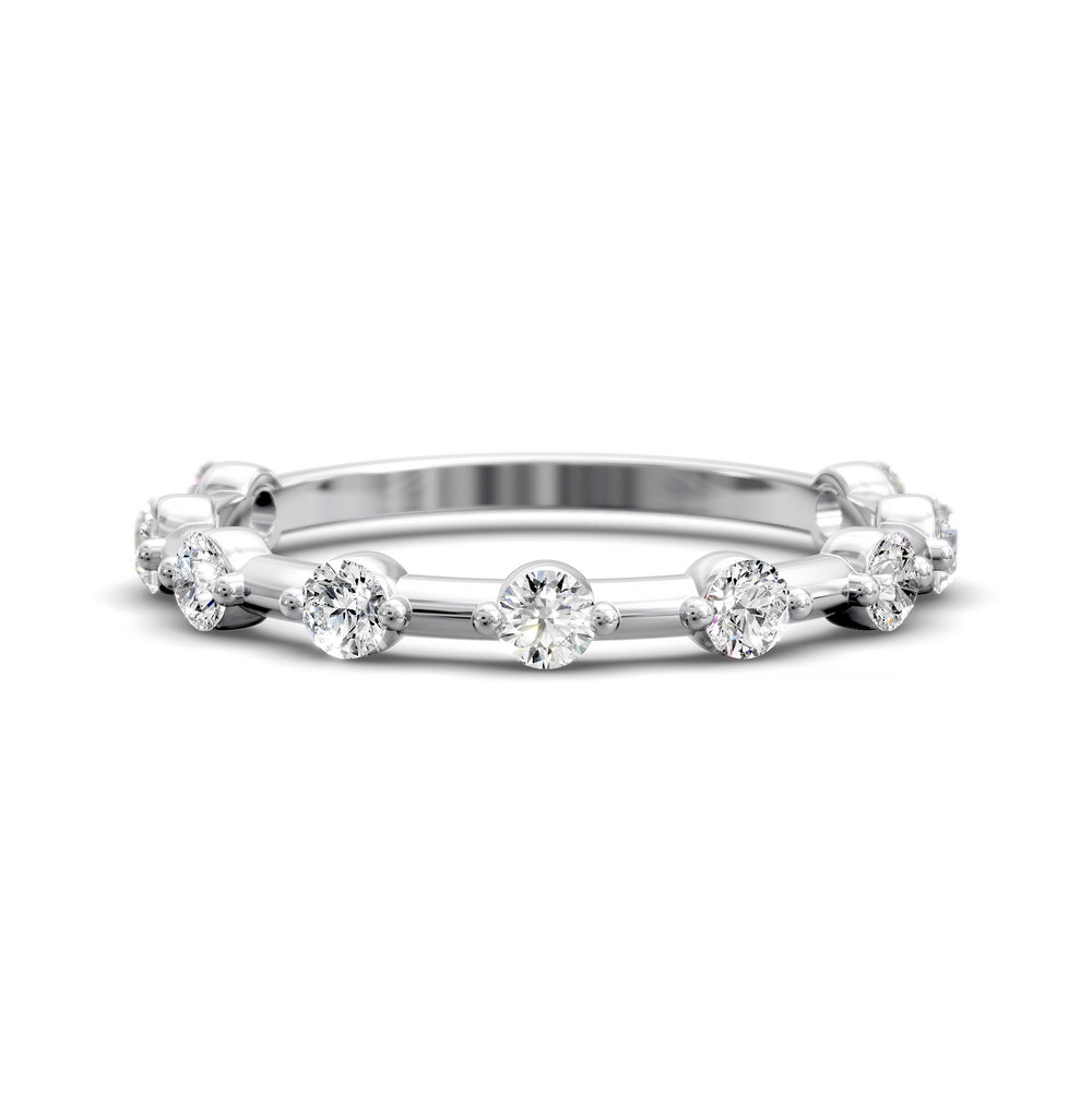 Shared prong eternity wedding band with spaced round diamonds