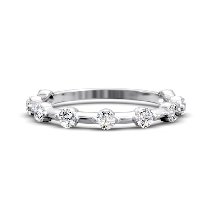 Shared prong eternity wedding band with spaced round diamonds