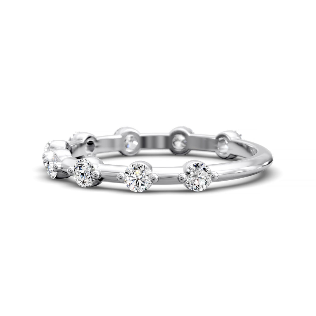 Shared prong eternity wedding band with spaced round diamonds