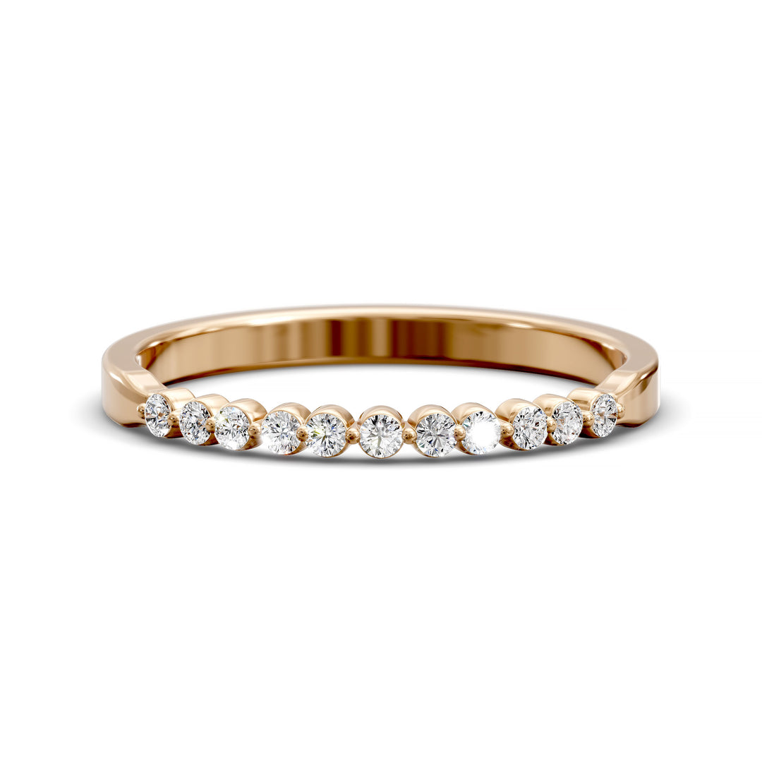 Tapered band with shared prong set round diamonds in minimalist design