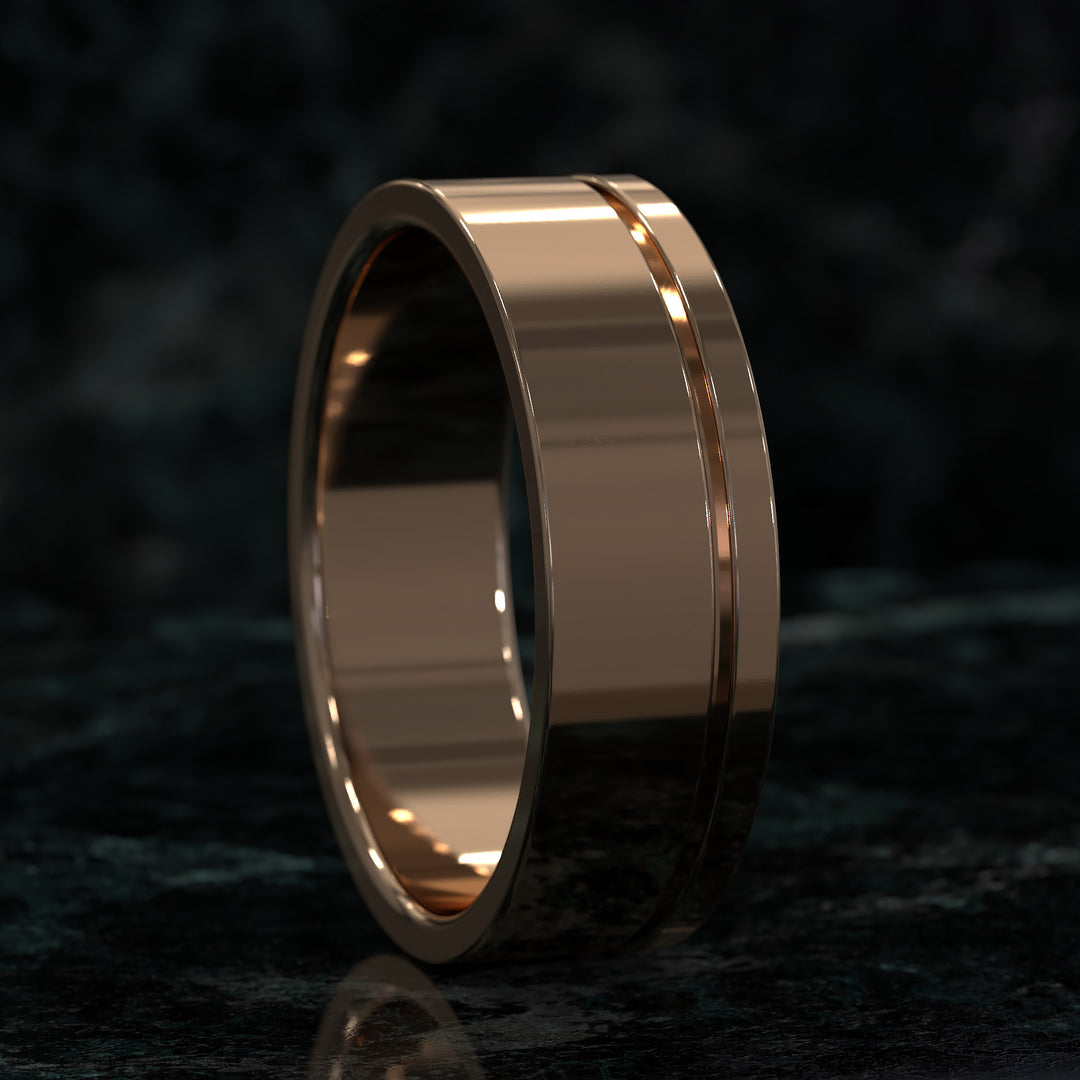 flat profile men’s wedding band with single polished edge design