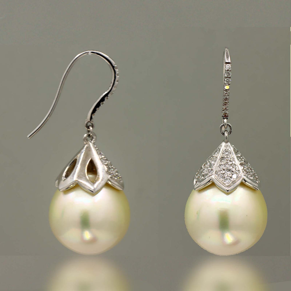 South Sea pearl earrings with 15mm light champagne pearls, 14K white gold, and small natural diamonds.