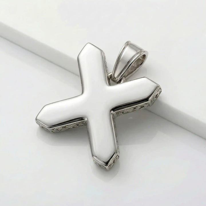St. Andrew diagonal cross pendant with engraved ornamental design displayed on white background.