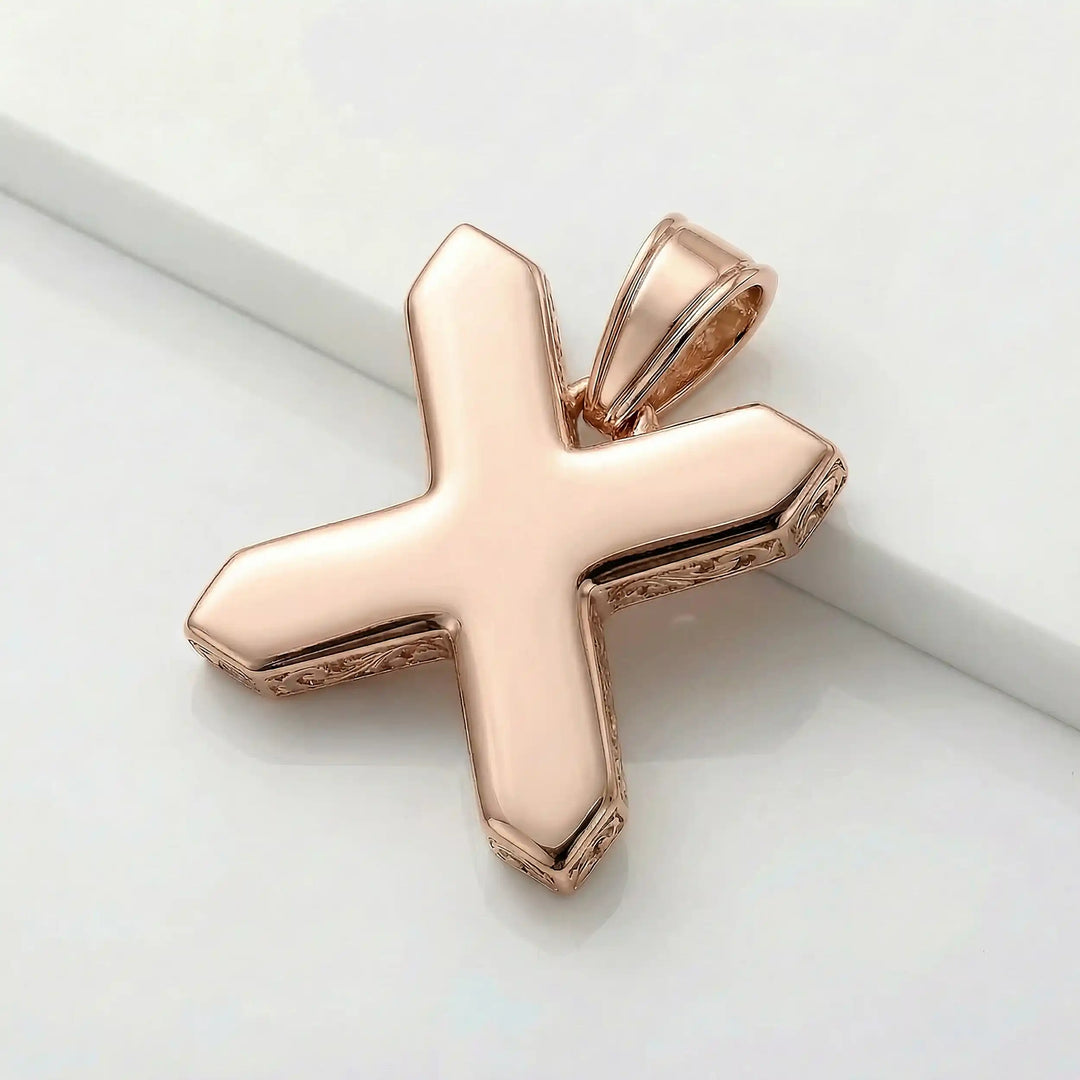 St. Andrew diagonal cross pendant with engraved ornamental design displayed on white background.