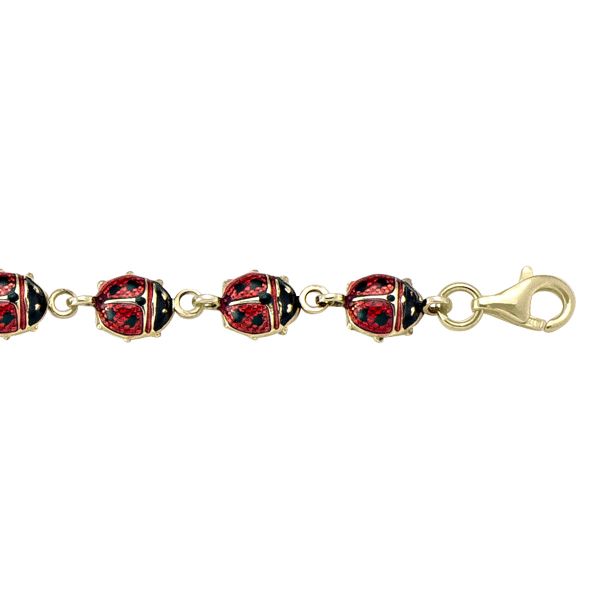 10k yellow gold ladybug bracelet with 6.6mm width, 7.25" length, featuring red and black enamel ladybugs and a secure lobster clasp.