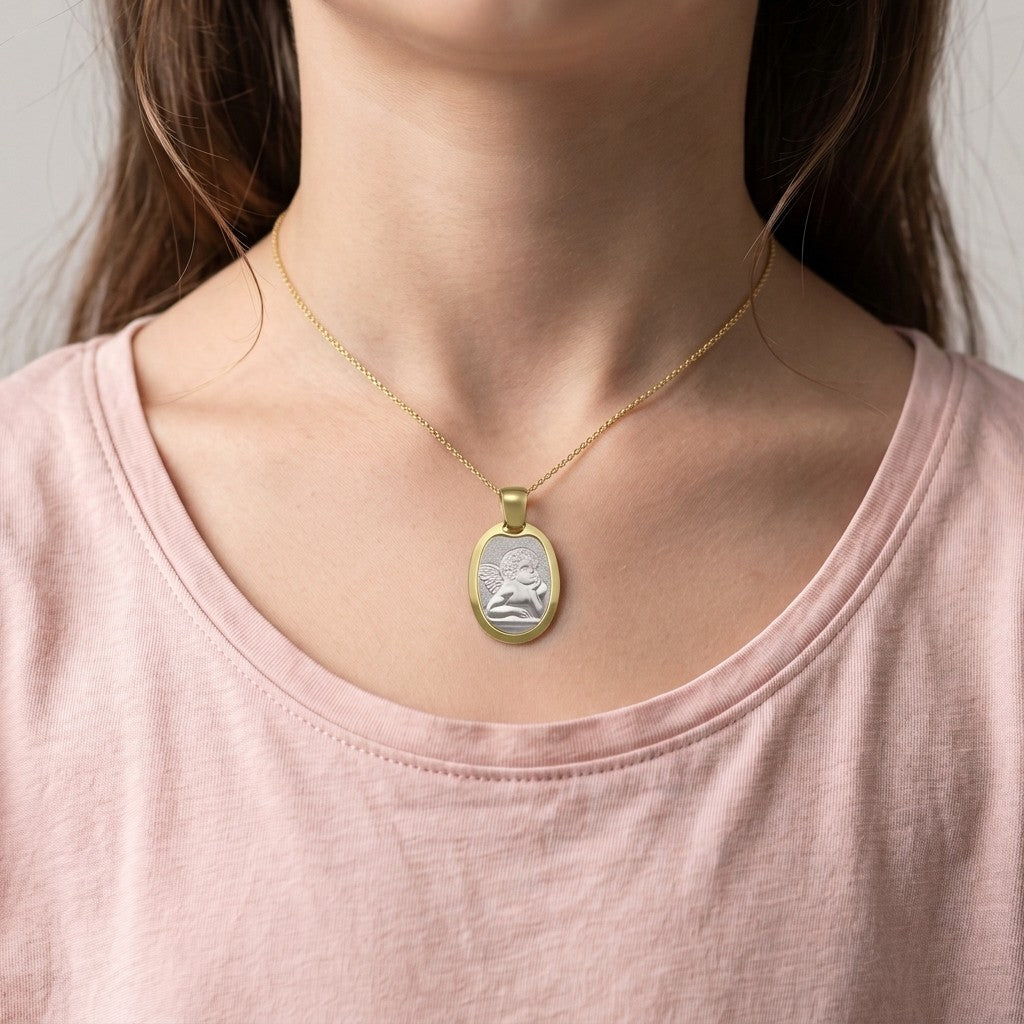 Two-Tone Gold Angel Medal worn on a model's neck on a fine chain