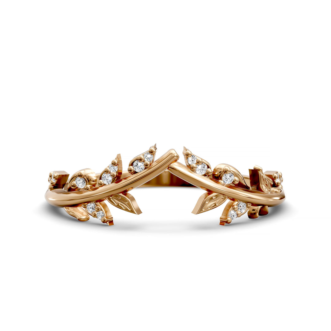 V-shaped nature-inspired wedding band with leaf motifs and round stones