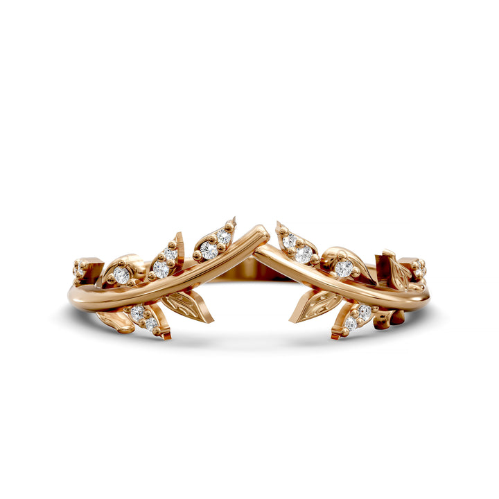 V-shaped nature-inspired wedding band with leaf motifs and round stones