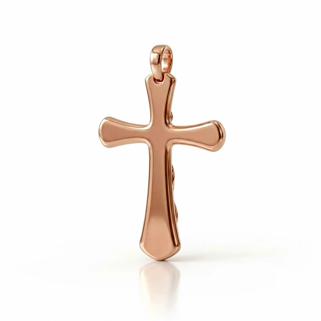 Vine cross pendant with engraved leaf detail displayed on female chest.