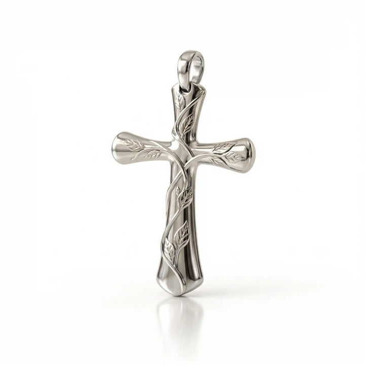 Vine cross pendant with engraved leaf detail displayed on white background.