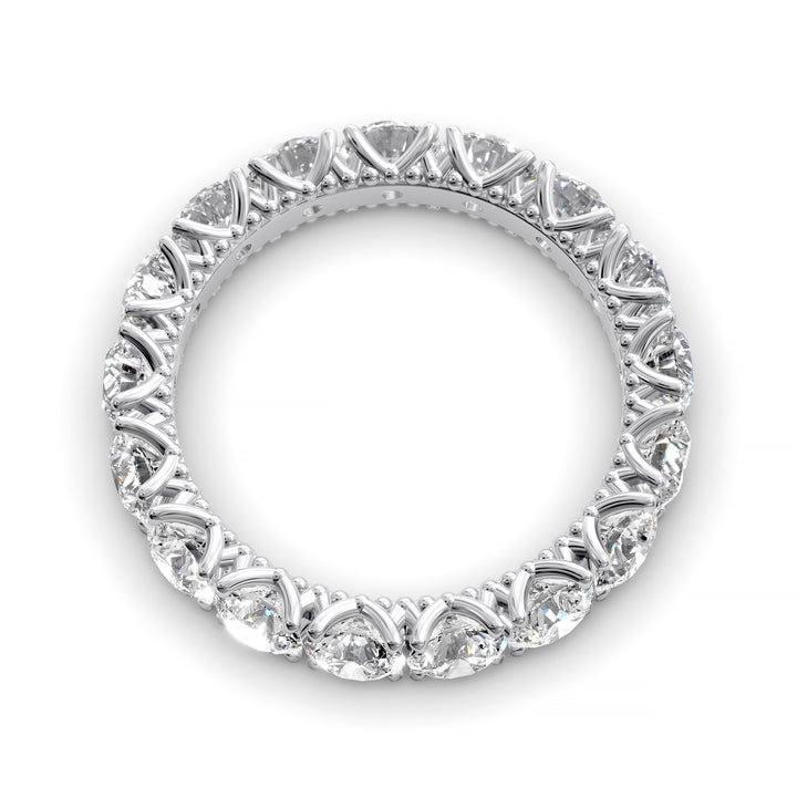 Vintage-inspired eternity band with round cut diamonds and intricate scalloped setting