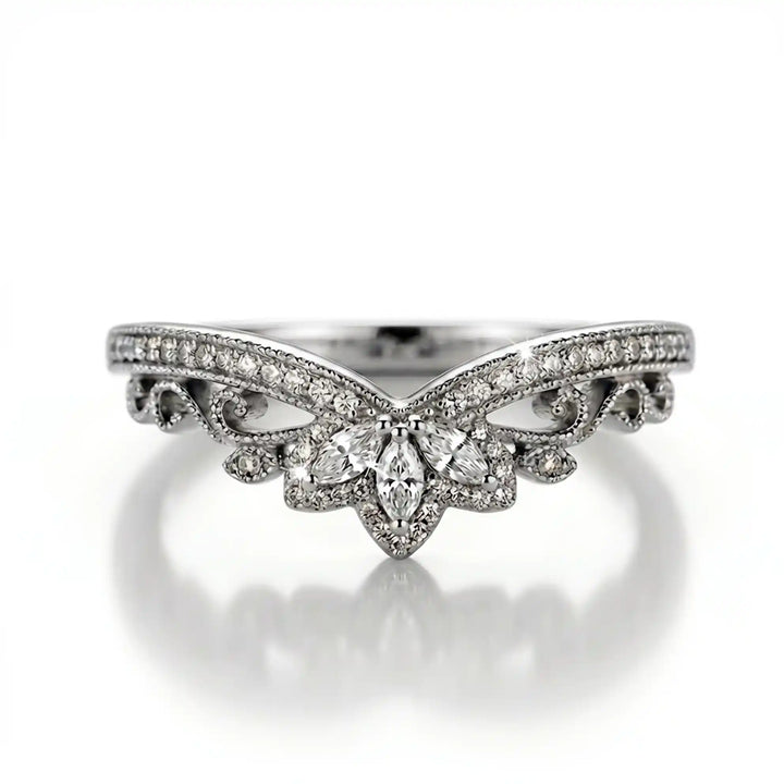 Vintage marquise floral lab-grown diamond wedding band with pavé accents on white background.