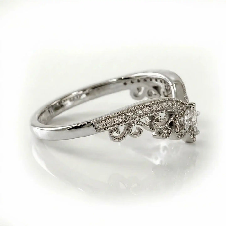 Vintage marquise floral lab-grown diamond wedding band with pavé accents on white background.