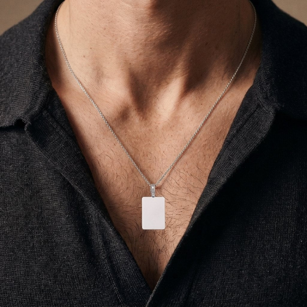 White gold plain rectangular tag pendant, 23 x 16 mm, 0.5 mm thick, worn by a man on a 22 inch chain
